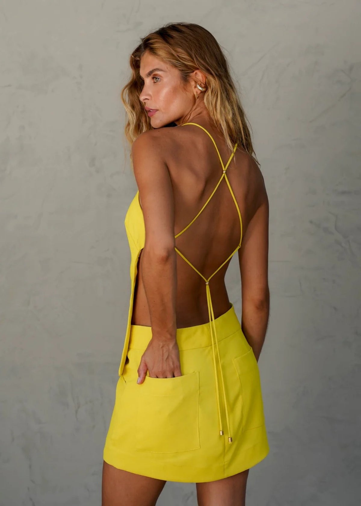 Solara Chantilly low-rise mini skort styled with ruffle resort top
