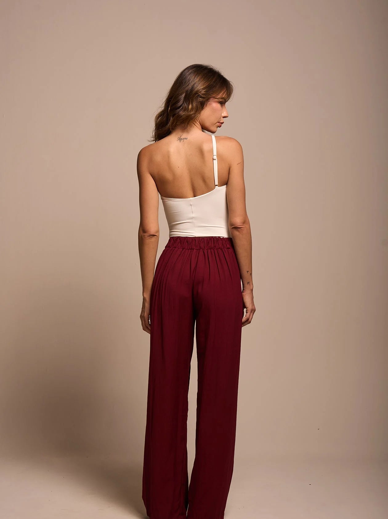 Back view of ruby wide-leg pants showing elastic waistband and fluid fit.