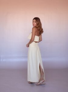 Back view of the Lumière Linen Set showing the button-back crop top and smocked waistband.